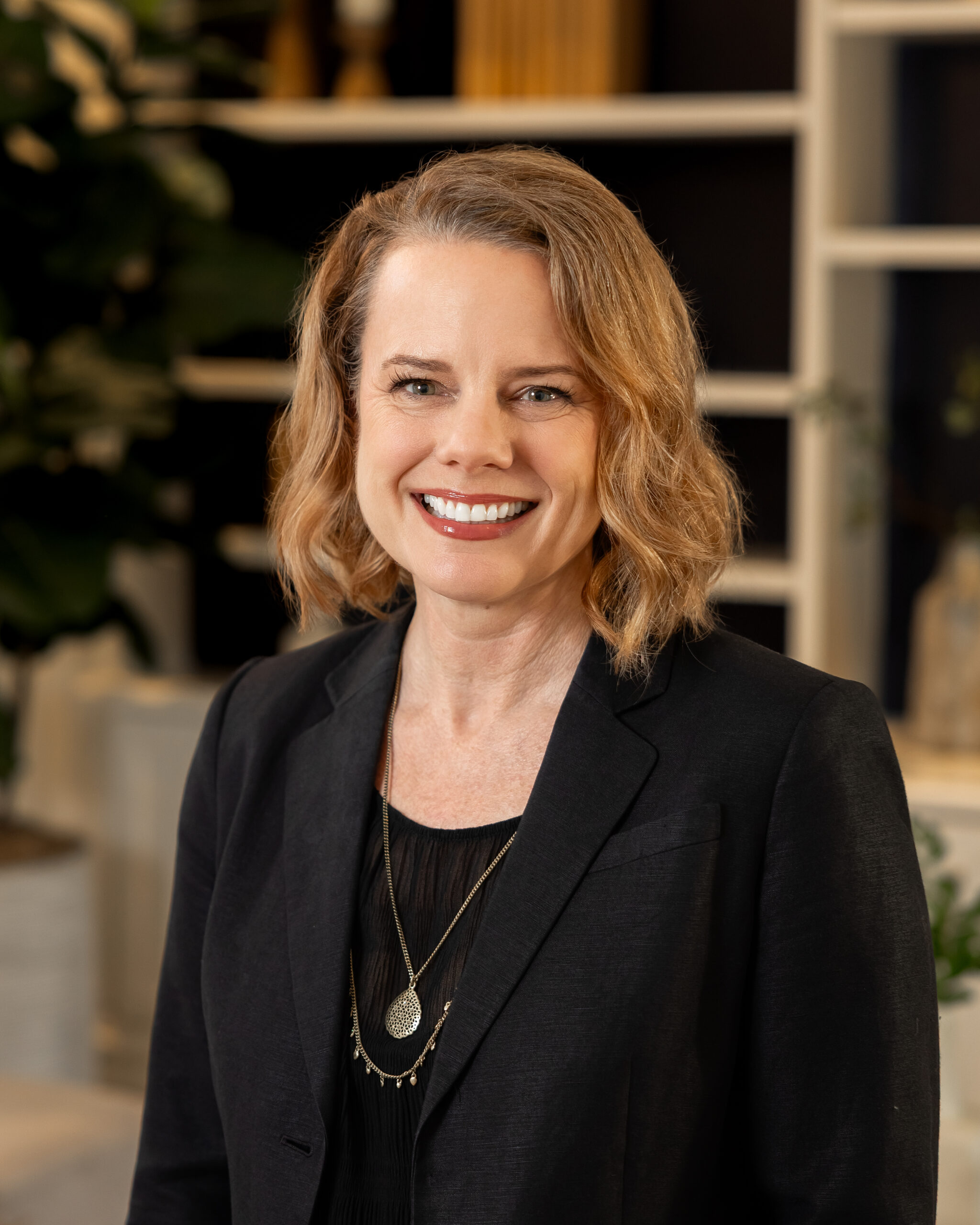 Black circular logo with a stylized letter N in the center.